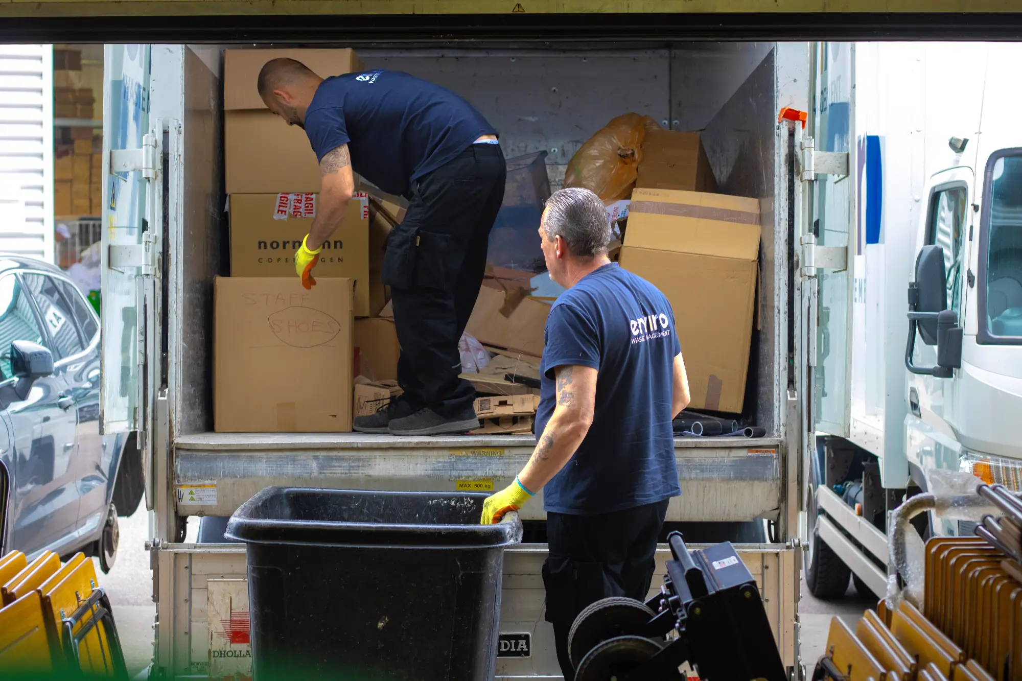 5 Steps for an Accurate Office Clearance Quote 1 Enviro Waste Management team loading office clearance waste into a collection vehicle